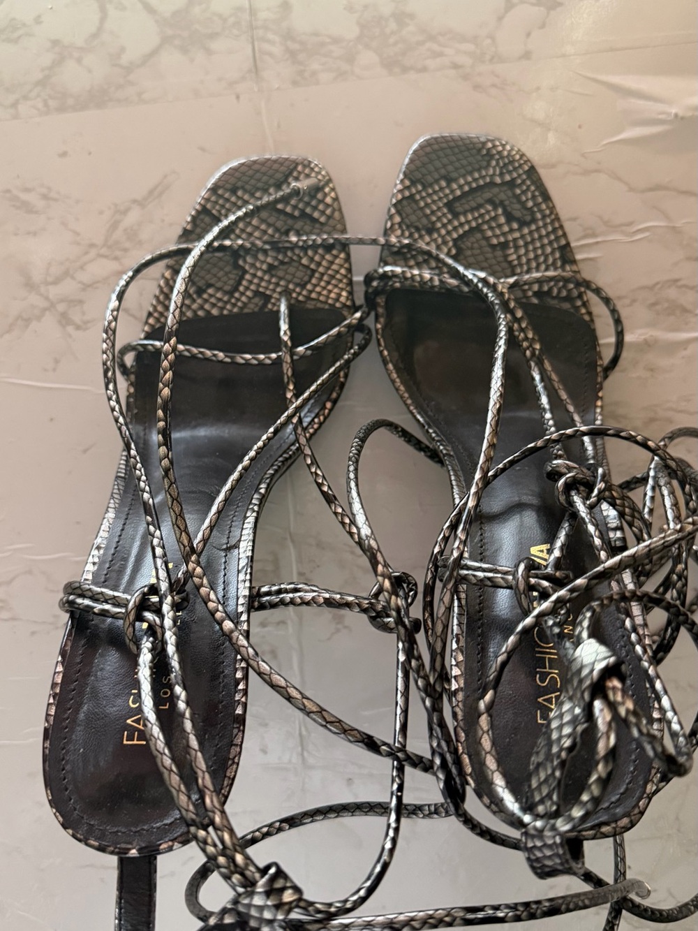 Strappy Snake-Print Lace-Up Sandals in Metallic Black